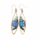 A pair of bronze marquise earrings with amazonite and pyrite gemstones surrounding rectangle crystals on sterling silver wire