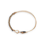 Brass arrow shaped cuff bracelet with faceted smokey quartz gemstones and tile