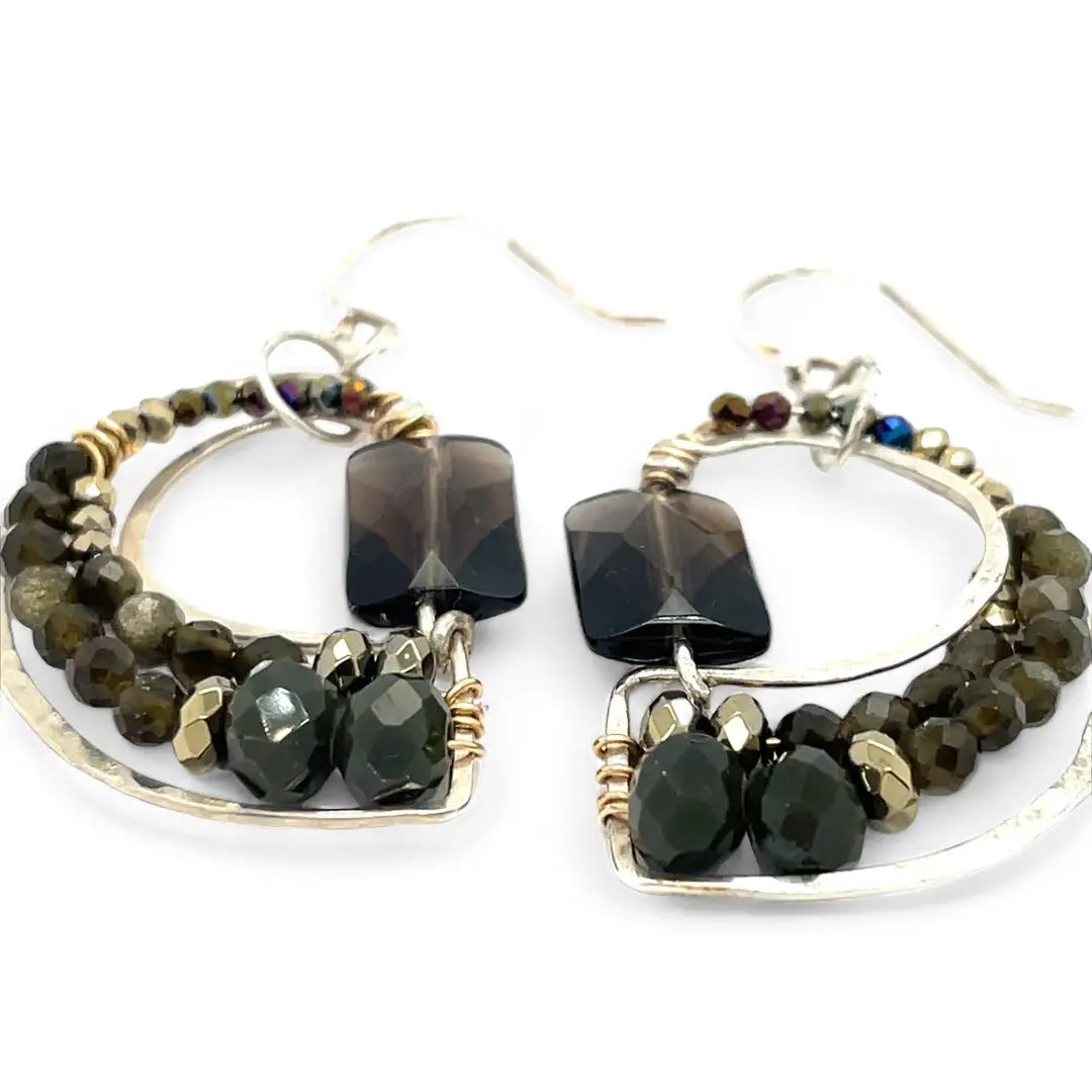 A pair of sterling silver earrings featuring smokey quartz, olive cat's eye micro-faceted gemstones, and pyrite gemstones on gold filled wire