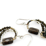 A pair of sterling silver earrings featuring smokey quartz, olive cat's eye micro-faceted gemstones, and pyrite gemstones on gold filled wire