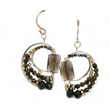 A pair of sterling silver earrings featuring smokey quartz, olive cat's eye micro-faceted gemstones, and pyrite gemstones on gold filled wire