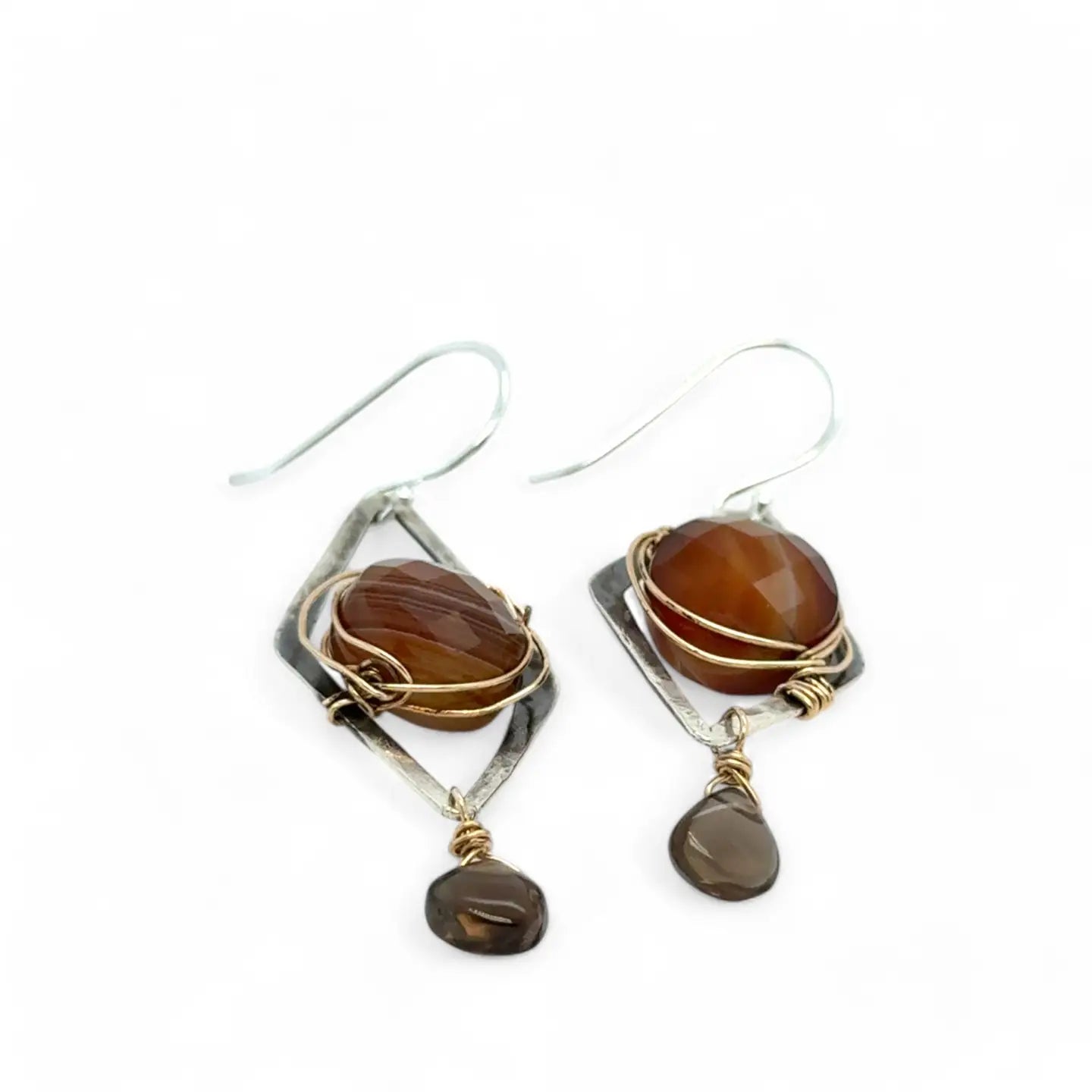 Rust colored striped agate coin gemstones are triple wrapped in gold filled wire on oxidized sterling silver diamond earrings with a smokey quartz smooth teardrop dangle