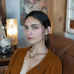 Rust colored striped agate coin gemstones are triple wrapped in gold filled wire on oxidized sterling silver diamond earrings with a smokey quartz smooth teardrop dangle