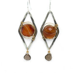 Rust colored striped agate coin gemstones are triple wrapped in gold filled wire on oxidized sterling silver diamond earrings with a smokey quartz smooth teardrop dangle