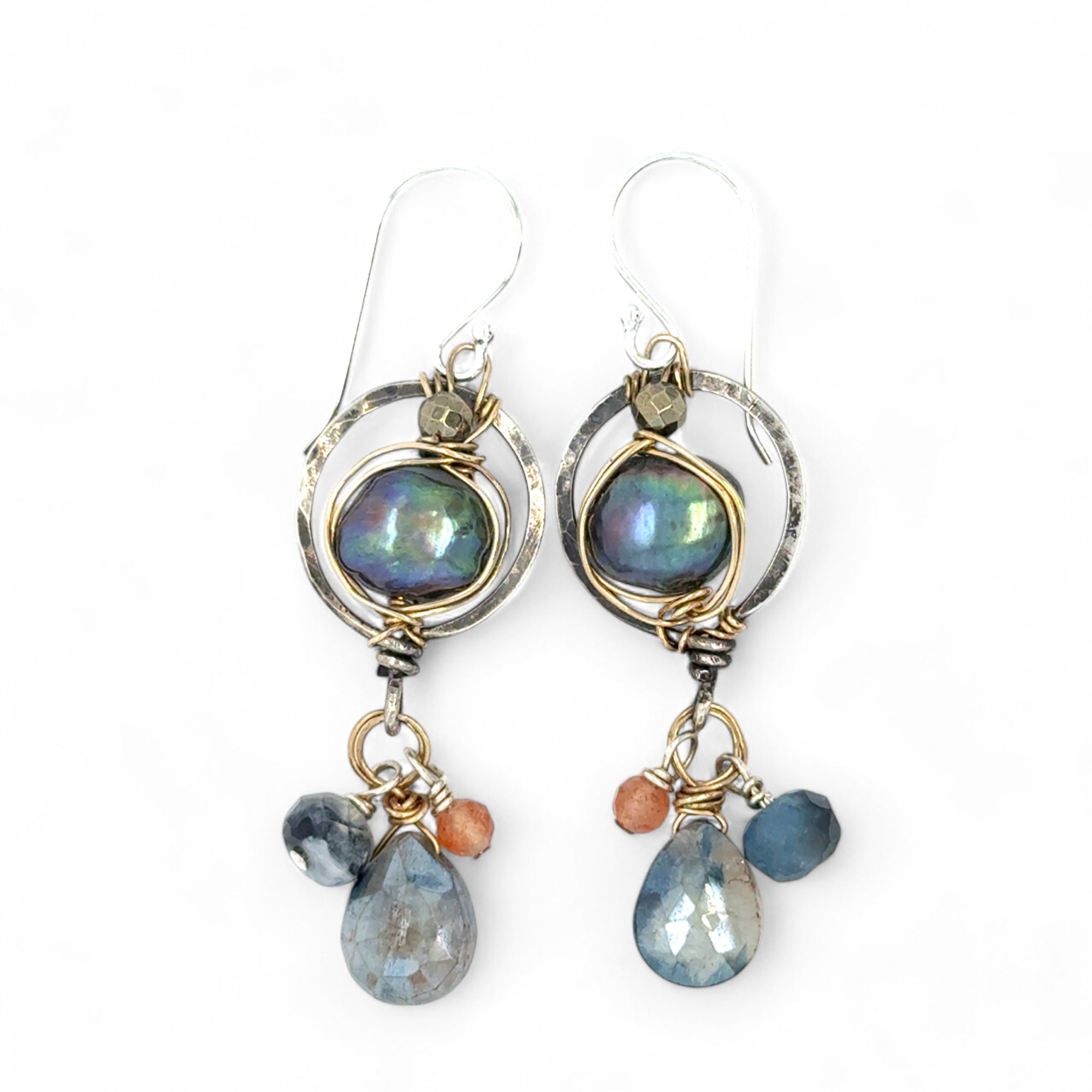 Darkened sterling silver mini circle earrings with fresh water peacock pealrs wrapped in gold filled wire, featuring sapphire, aquamarine, and sunstone dangles