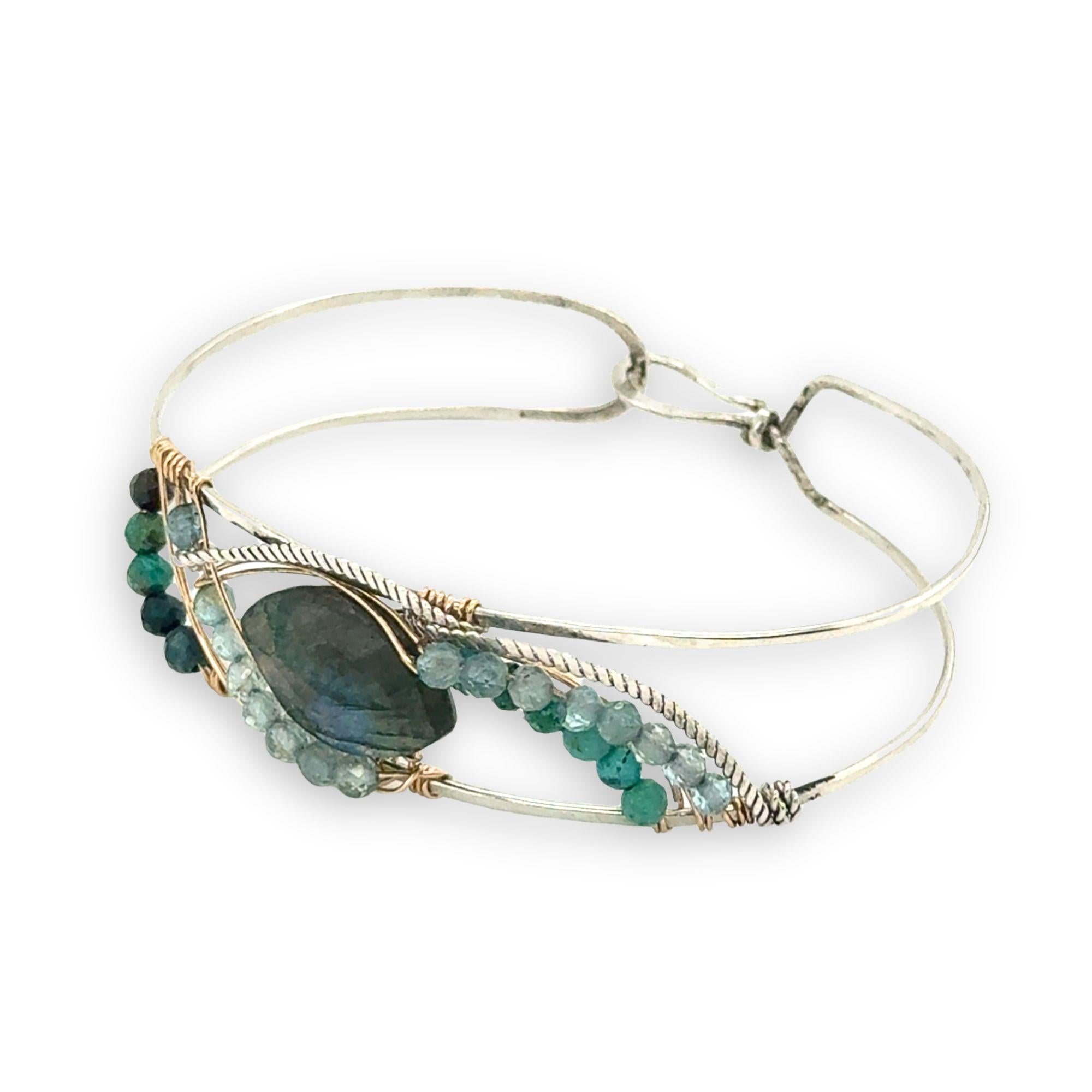 Apatite and chrysocolla gemstones surround a labradorite marquise gemstones held in gold filled and oxidized sterling silver twist wire inside a sterling silver handmade cuff bracelet