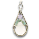 Sterling silver twisted wire drop earrings with white jade drops, lavender cubic zirconia and emerald cube gemstones on a textured link