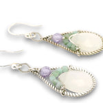 Sterling silver twisted wire drop earrings with white jade drops, lavender cubic zirconia and emerald cube gemstones on a textured link