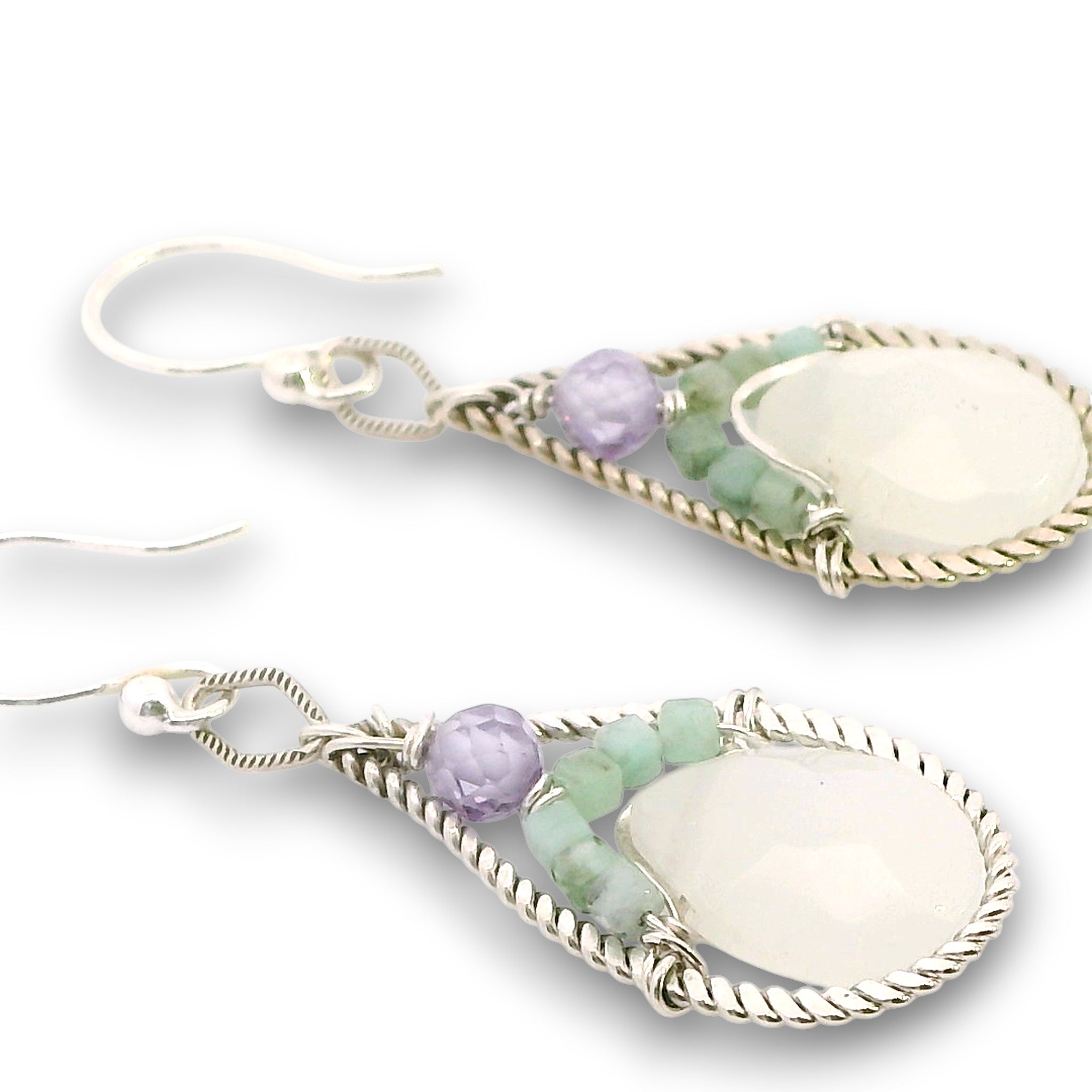 Sterling silver twisted wire drop earrings with white jade drops, lavender cubic zirconia and emerald cube gemstones on a textured link
