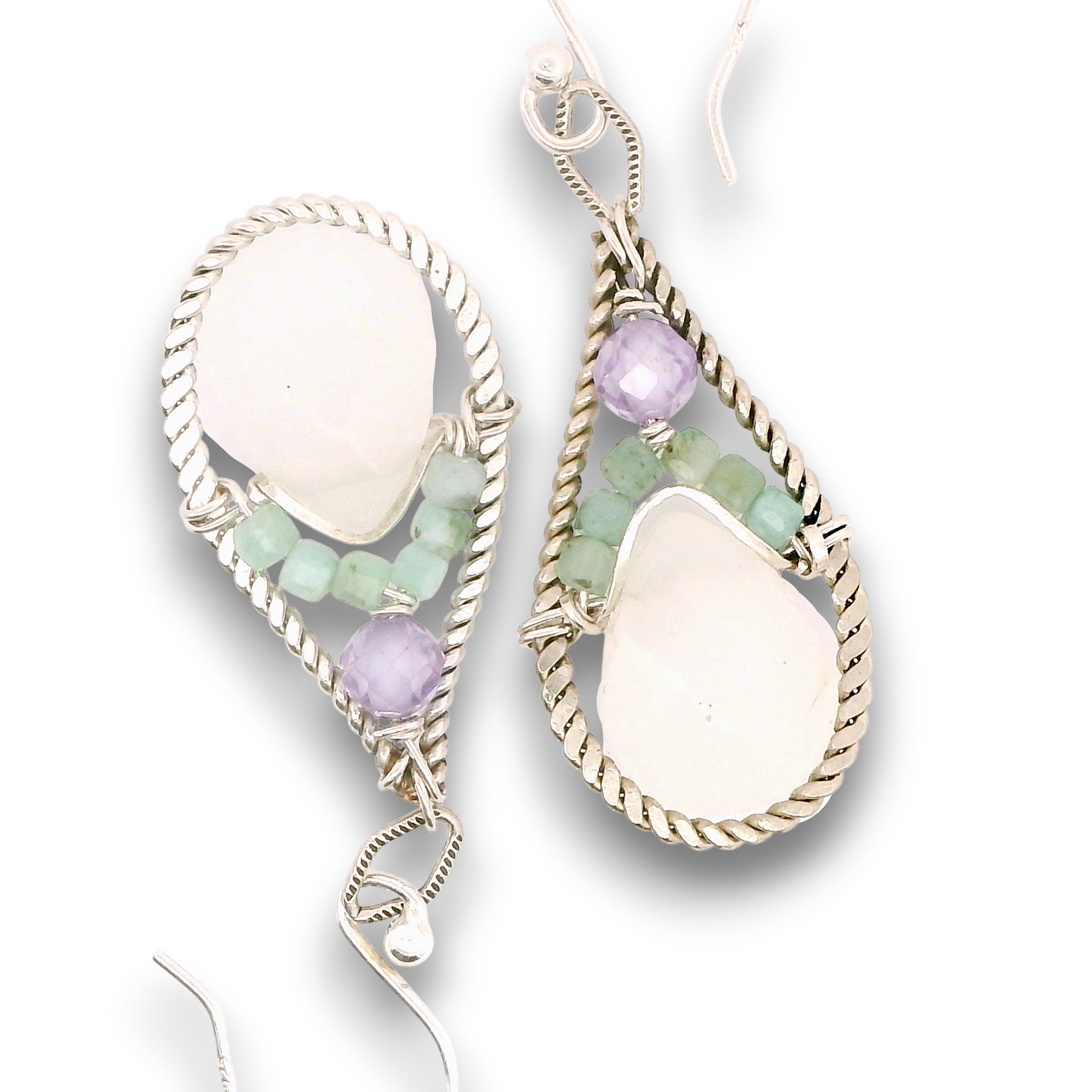 Sterling silver twisted wire drop earrings with white jade drops, lavender cubic zirconia and emerald cube gemstones on a textured link
