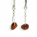 Handmade hammered sterling silver bar earrings with a rust orange colored fresh water pearl dangle