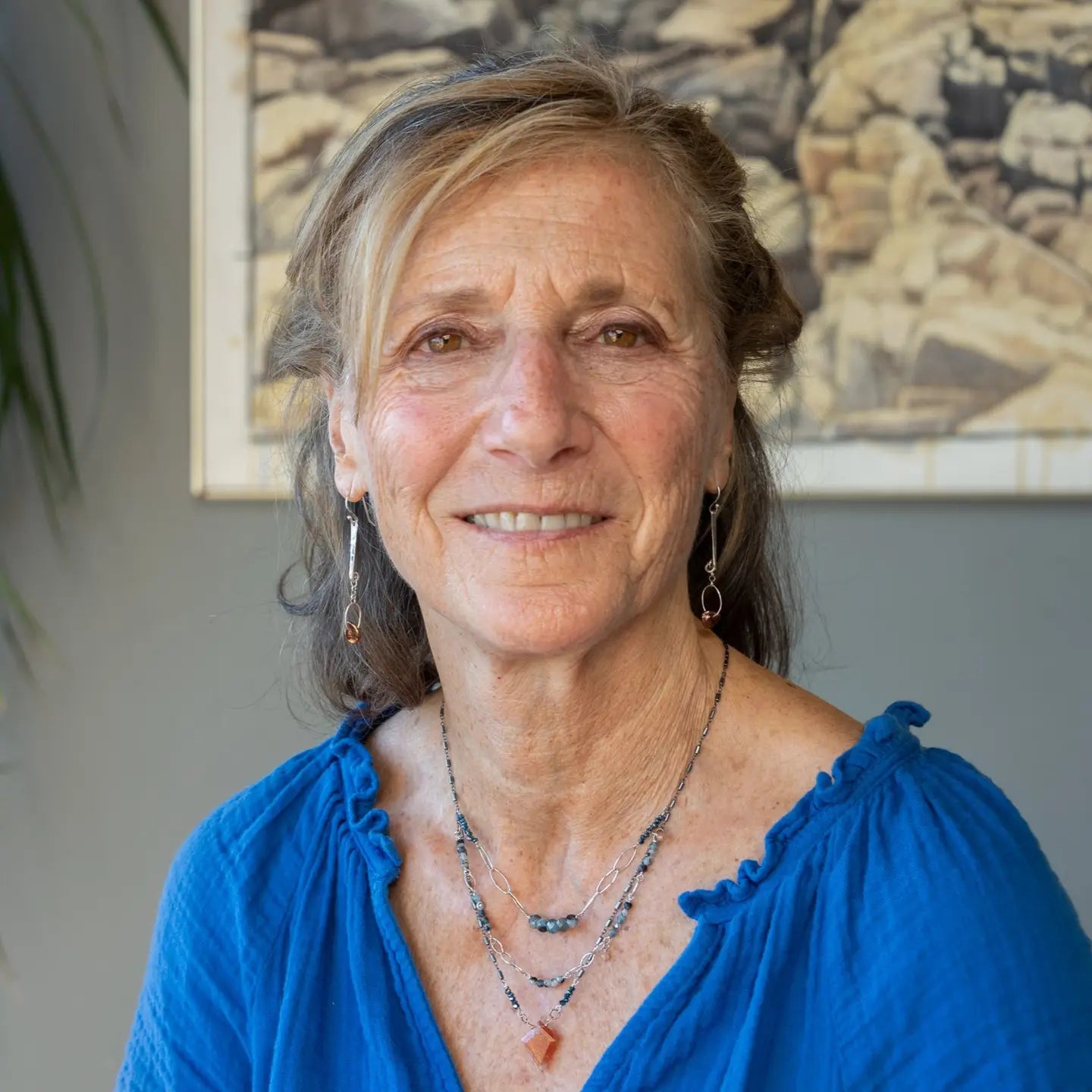 Handmade hammered sterling silver bar earrings with a rust orange colored fresh water pearl dangle