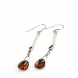 Handmade hammered sterling silver bar earrings with a rust orange colored fresh water pearl dangle