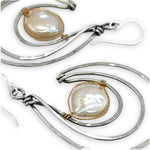 Pair of sterling silver statement earrings with fresh water pearl coins held in gold filled and brass twist wires