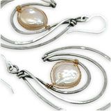 Pair of sterling silver statement earrings with fresh water pearl coins held in gold filled and brass twist wires