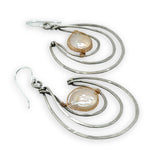 Pair of sterling silver statement earrings with fresh water pearl coins held in gold filled and brass twist wires