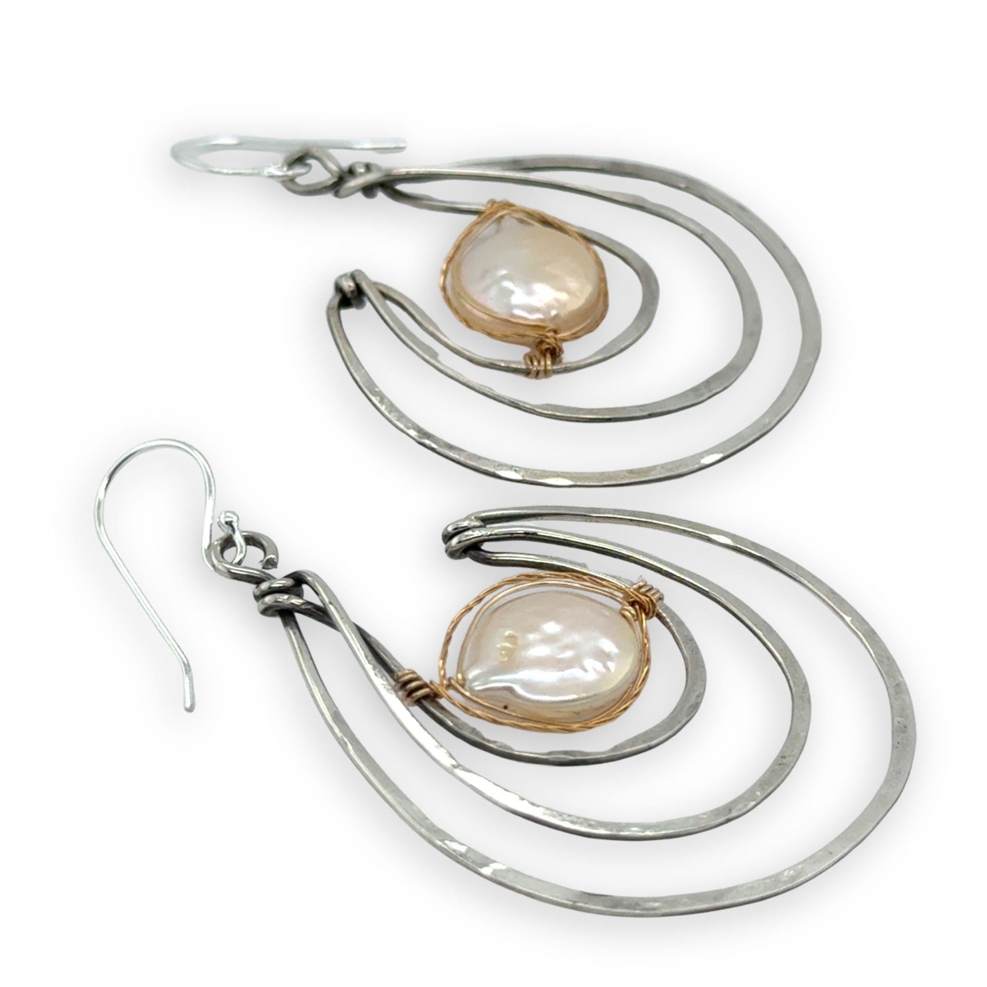 Pair of sterling silver statement earrings with fresh water pearl coins held in gold filled and brass twist wires