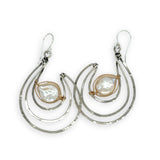 Pair of sterling silver statement earrings with fresh water pearl coins held in gold filled and brass twist wires