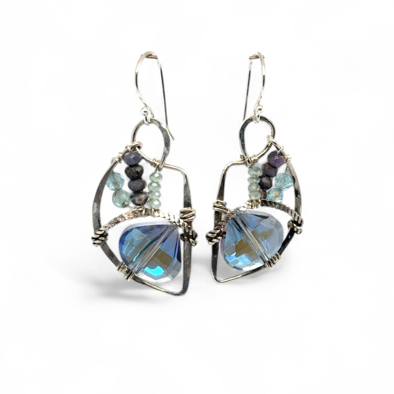A pair of sterling silver earrings with blue crystal teardrops, apatite, crystal, and sodalite gemstones
