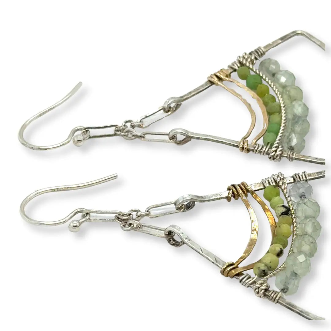 Large sterling silver fan shaped earrings decorated with gaspeite and jade faceted gemstones, brass wire, and sterling silver twist wire