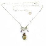 Striped green blue agate drop and lavender cubic zirconia drops hang from a hammered sterling silver mini pendant containing moontstone and prehnite gemstones on a sterling silver tube chain necklace