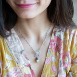 Striped green blue agate drop and lavender cubic zirconia drops hang from a hammered sterling silver mini pendant containing moontstone and prehnite gemstones on a sterling silver tube chain necklace