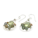 A pair of sterling silver drop earrings with faceted green kyanite gemstones and green amethyst coins, held on bar chain stems.