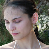 Tree stamped brass semi circle earrings embellished with green amethyst coins, prehnite, emerald, crystal, and african brass beads wrapped in gold filled wire with built in sterling silver earring hooks that wear like a post earring