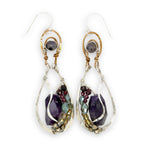 Dark amethyst nuggets are lined with pyrite, crystal, and garnet gemstones in sterling silver wire within sterling silver drops, hanging from bronze channel tops with iolite gemstones