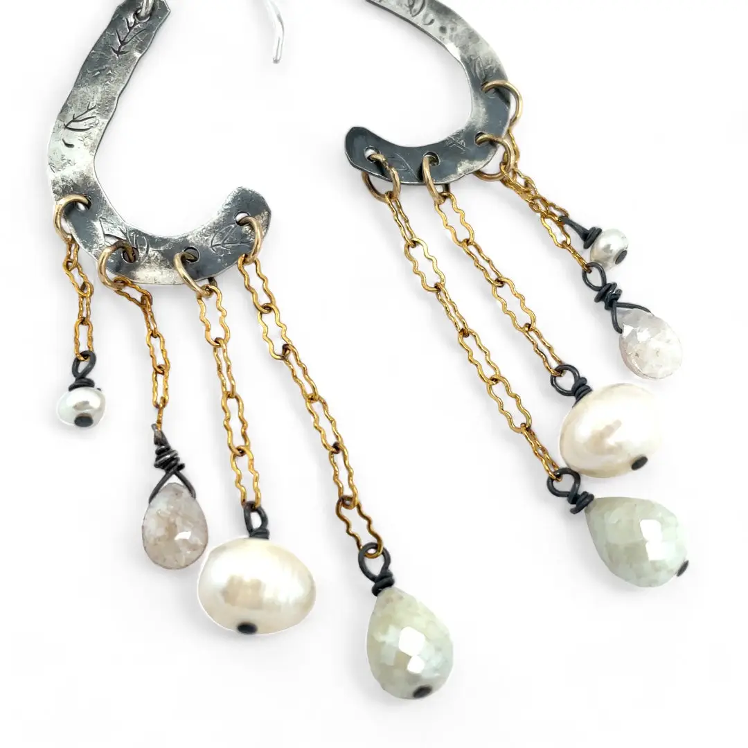 A pair of sterling silver oxidized lead stamped cloud-shaped earrings with white sapphire faceted drops fresh water pearls hanging from gold-filled crinkle chains