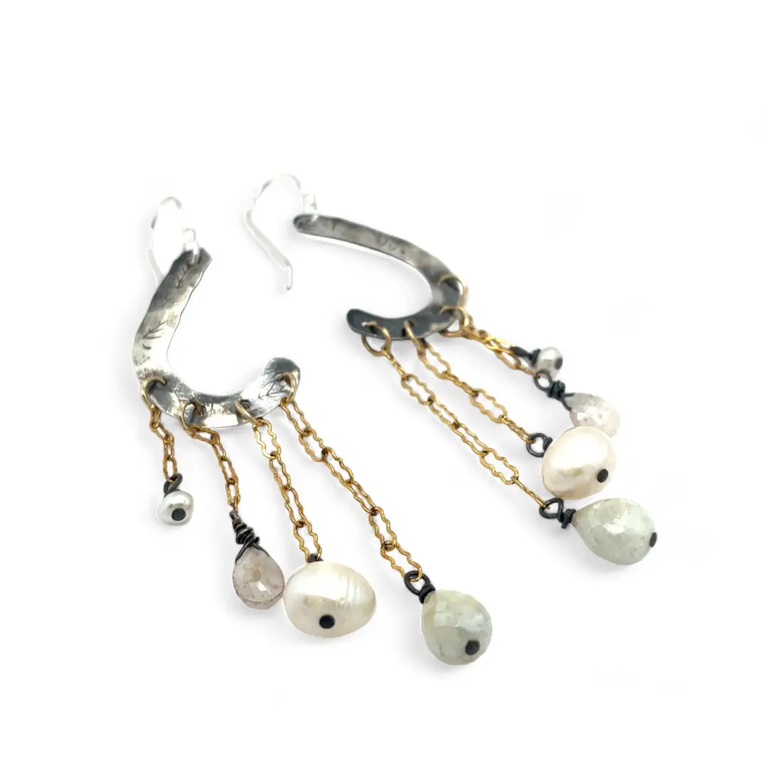 A pair of sterling silver oxidized lead stamped cloud-shaped earrings with white sapphire faceted drops fresh water pearls hanging from gold-filled crinkle chains