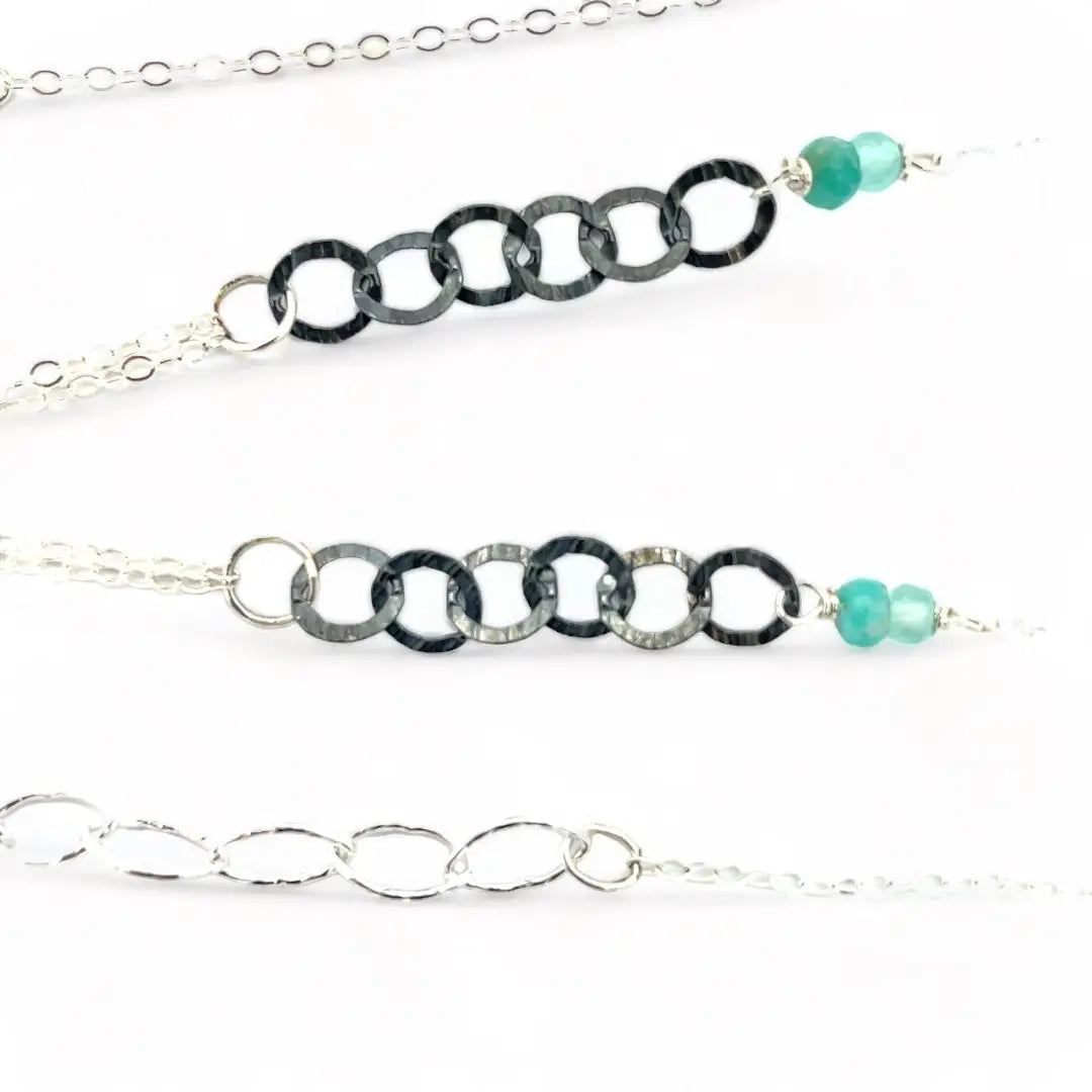 A mini sterling silver drop pendant with amazonite and pyrite gemstones in gold filled wire on a dainty sterling silver chain with oxidized sterling crinkle chain accent necklace