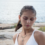 Mint colored chalcedony marquise gemstones accented with turquoise inside a tiny brass hammered marquise earring on hammered sterling silver ring earrings