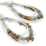 Labradorite, citrine, hessonite garnet, prehnite, and crystal gemstones are held within the channel of handmade sterling silver channel drop earrings