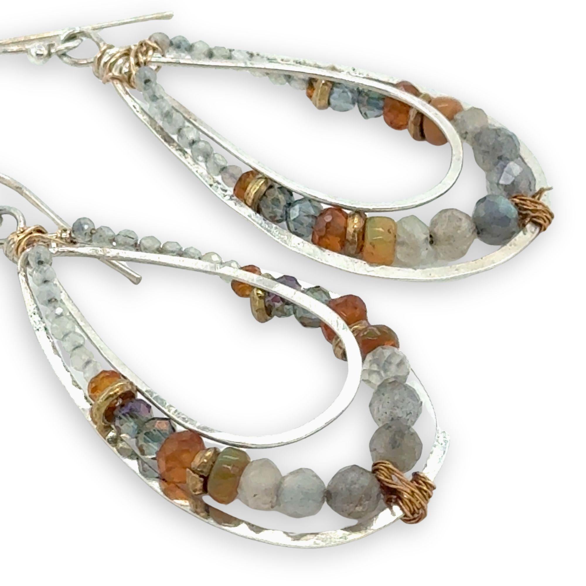 Labradorite, citrine, hessonite garnet, prehnite, and crystal gemstones are held within the channel of handmade sterling silver channel drop earrings