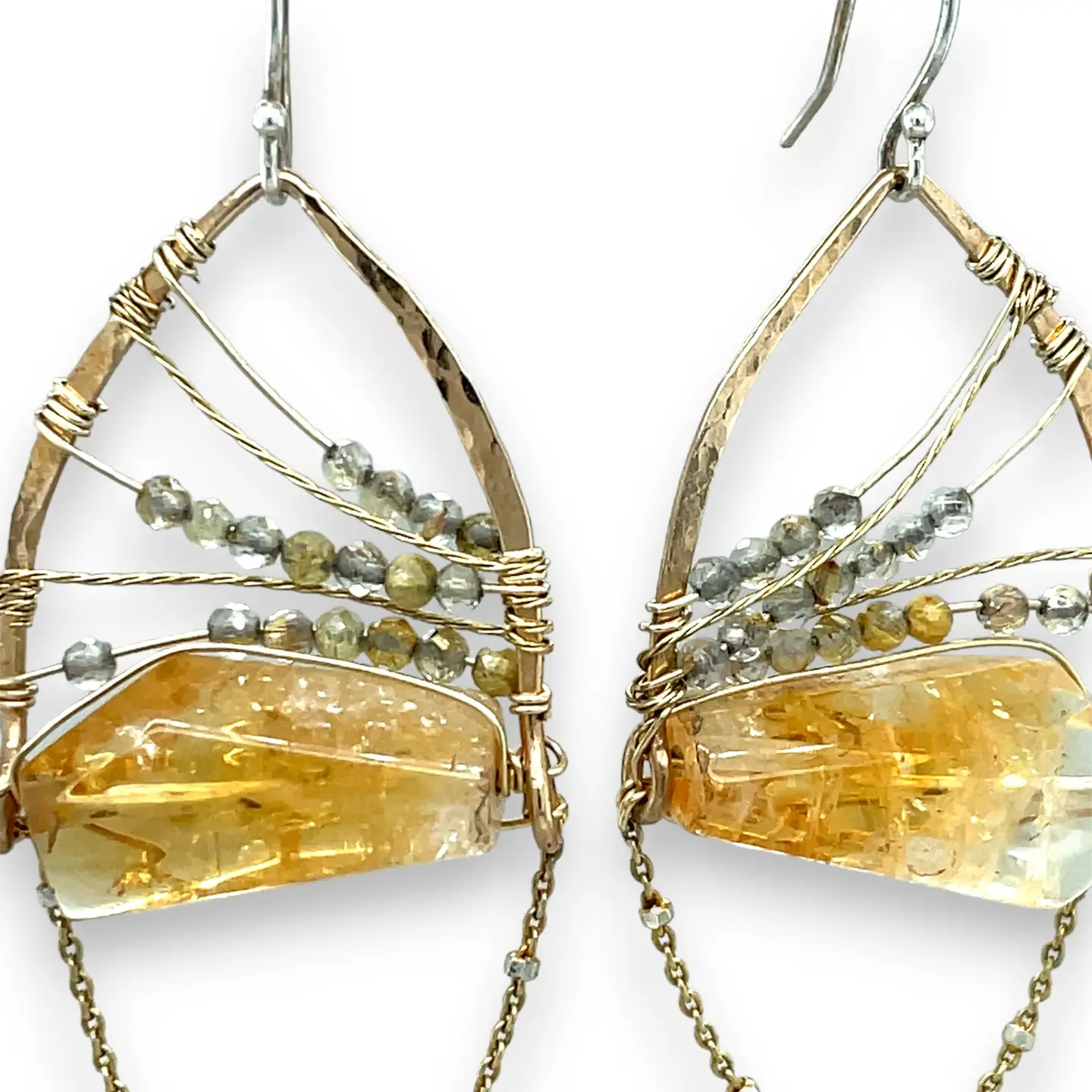 Citrine nuggets held in a bronze marquise earring frame accompanied by gold filled wire, rutilated quartz gemstones, and gold filled satellite chain