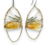 Citrine nuggets held in a bronze marquise earring frame accompanied by gold filled wire, rutilated quartz gemstones, and gold filled satellite chain