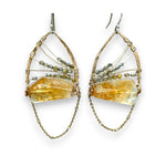 Citrine nuggets held in a bronze marquise earring frame accompanied by gold filled wire, rutilated quartz gemstones, and gold filled satellite chain