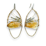 Citrine nuggets held in a bronze marquise earring frame accompanied by gold filled wire, rutilated quartz gemstones, and gold filled satellite chain