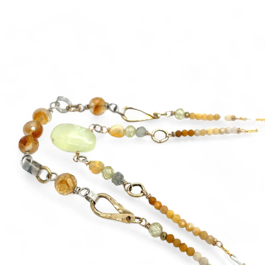 smooth prehnite, opal, green amethyst and mookaite gemstones form the inner layer while the outside is made up of faceted citrine orbs, brass hammered teardrops, and mookaite ombre gemstones necklace