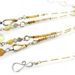 smooth prehnite, opal, green amethyst and mookaite gemstones form the inner layer while the outside is made up of faceted citrine orbs, brass hammered teardrops, and mookaite ombre gemstones necklace