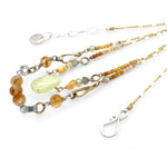 smooth prehnite, opal, green amethyst and mookaite gemstones form the inner layer while the outside is made up of faceted citrine orbs, brass hammered teardrops, and mookaite ombre gemstones necklace