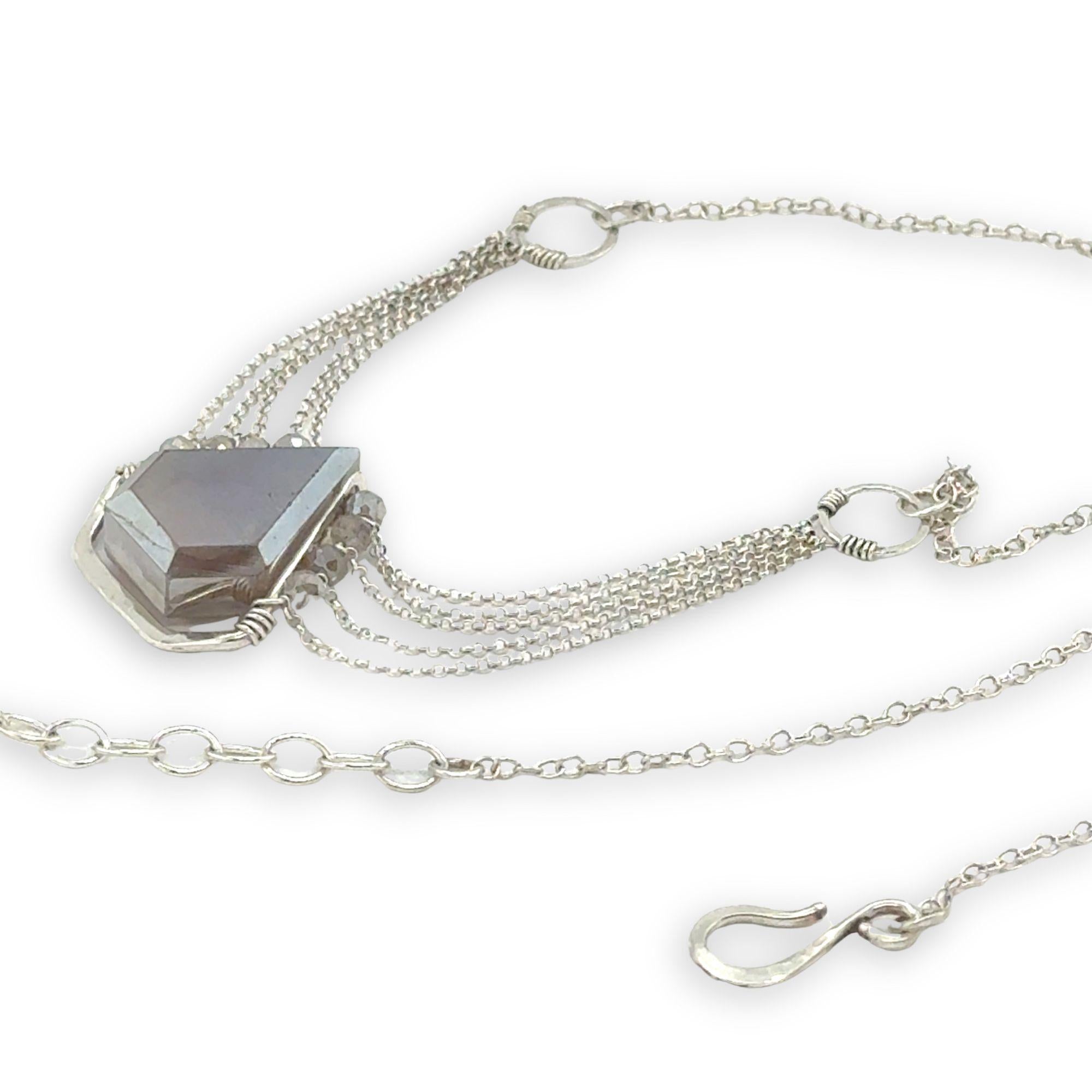 pointed moonstone in a sterling silver mini pendant necklace with multi chains onto handmade sterling silver rings