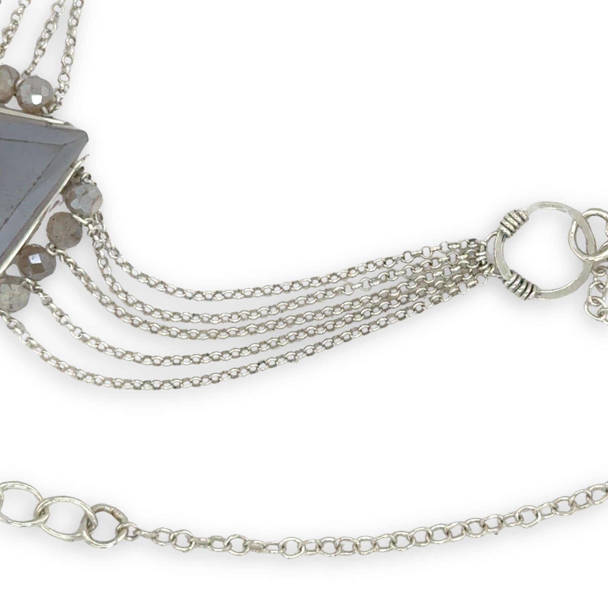 pointed moonstone in a sterling silver mini pendant necklace with multi chains onto handmade sterling silver rings