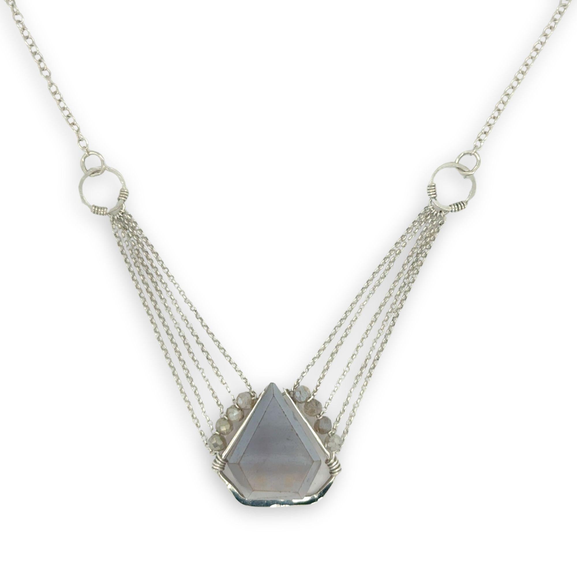 pointed moonstone in a sterling silver mini pendant necklace with multi chains onto handmade sterling silver rings