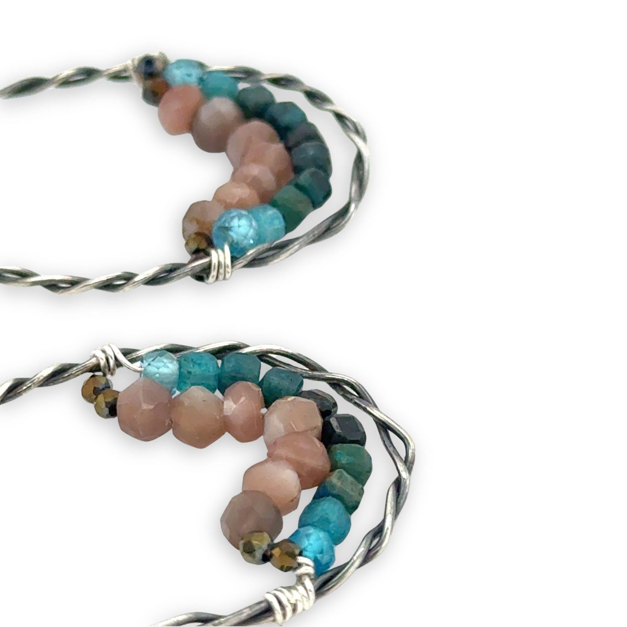darkened sterling silver twisted hoop earrings with pyrite, mauve moonstone, and chrysocolla faceted gemstones