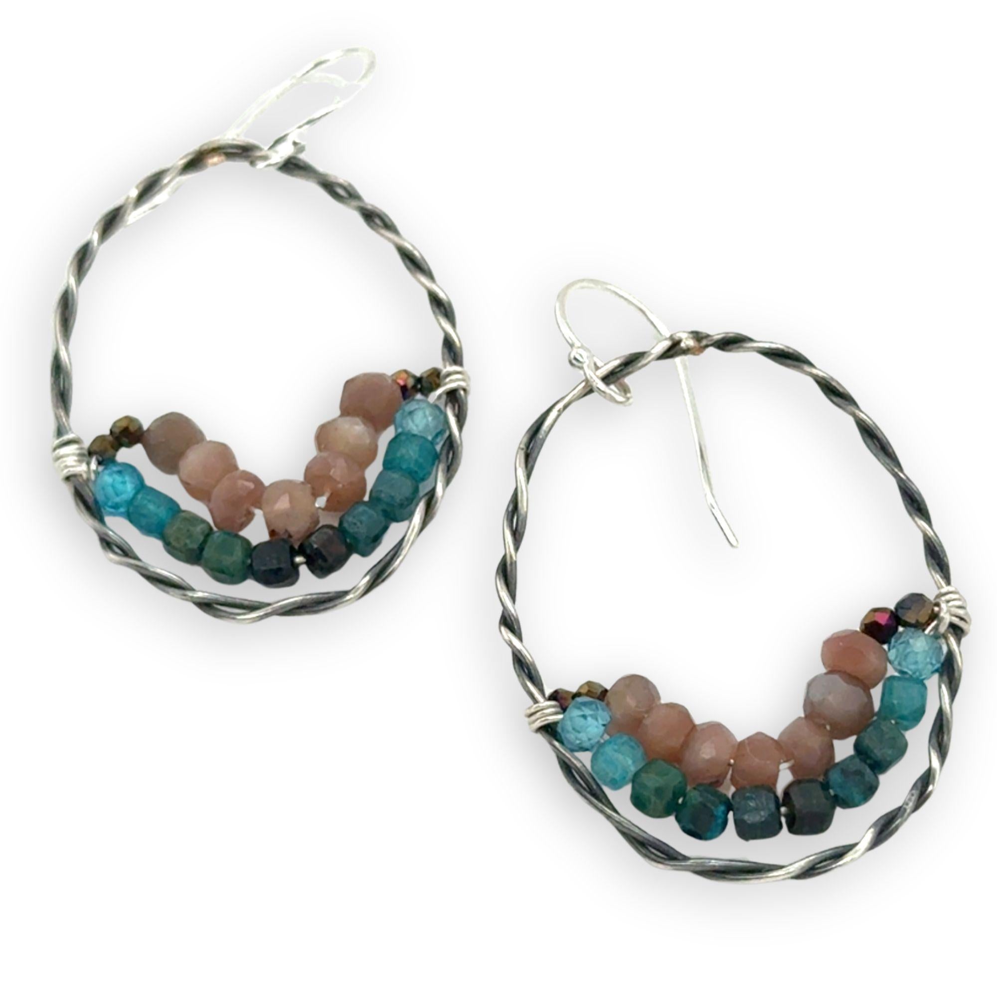 darkened sterling silver twisted hoop earrings with pyrite, mauve moonstone, and chrysocolla faceted gemstones