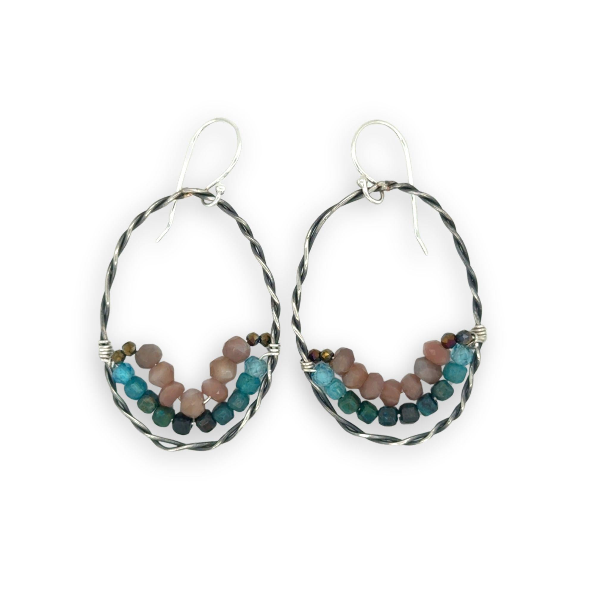 darkened sterling silver twisted hoop earrings with pyrite, mauve moonstone, and chrysocolla faceted gemstones