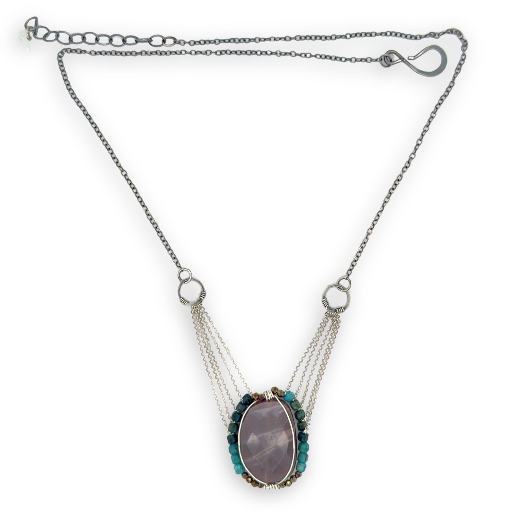 Mauve moonstone nugget pendant surrounded by pyrite and chrysocolla cube gemstones with multi layered chain webbing necklace