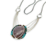 Mauve moonstone nugget pendant surrounded by pyrite and chrysocolla cube gemstones with multi layered chain webbing necklace